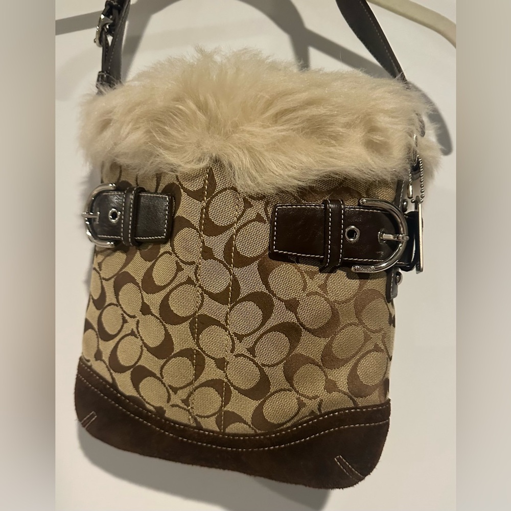 Coach signature C canvas and leather shoulder bag with lamb shearling trim